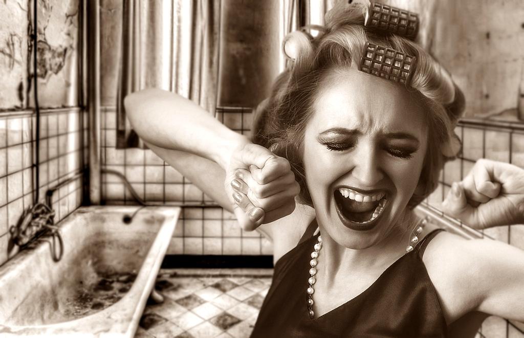 Modern tidy bathroom with minimalist storage and clean surfaces