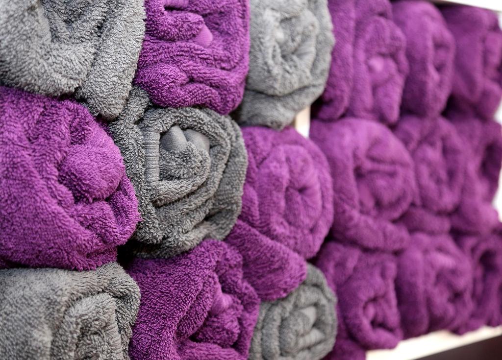 Neat bathroom with towel storage and organized toiletries