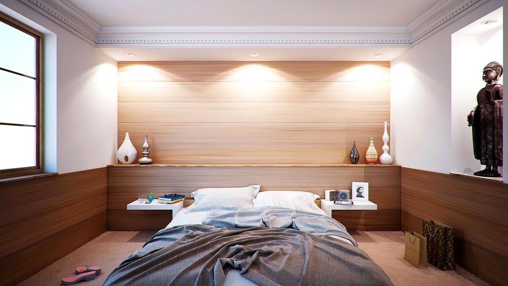 Organized bedroom closet with hanging clothes and folded items