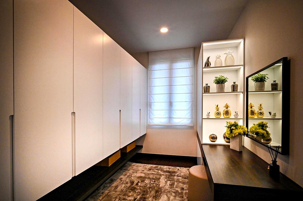 Organized bedroom closet with folded clothes and storage boxes