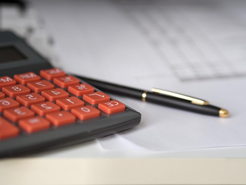 Organized home office desk with neat files and accessories