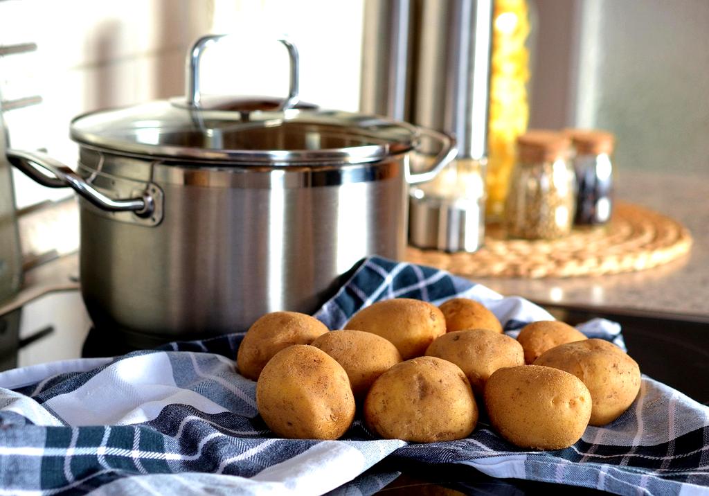 Organized modern kitchen with clean countertops and neatly stored utensils