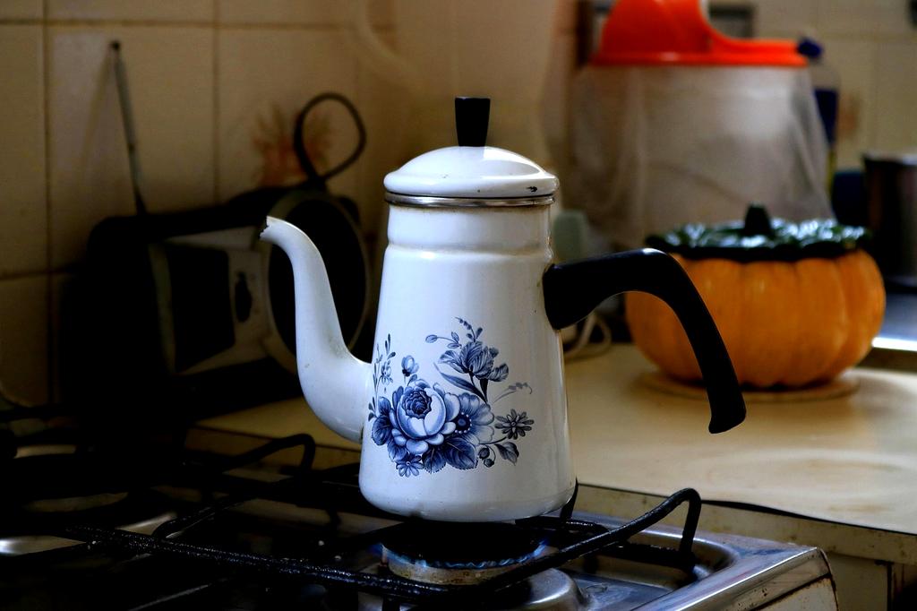 Close-up of neatly labeled containers on kitchen shelf