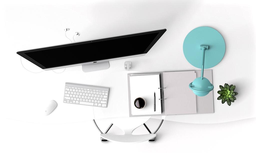 Tidy office desk with labeled storage boxes and organized files