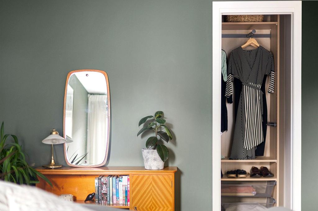 Smart LED lights automatically adjusting brightness in organized bedroom